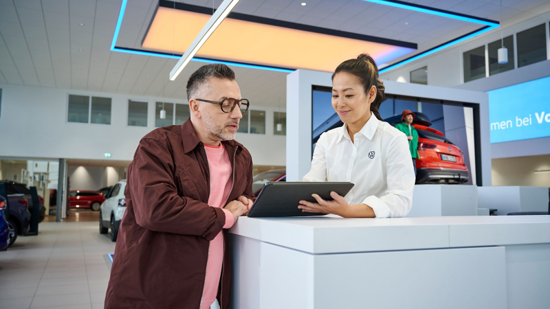 A person inside a Volkswagen dealership