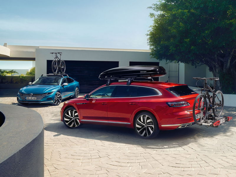 Two SUV VW Cars with Roof Rack and bike attachment accessories