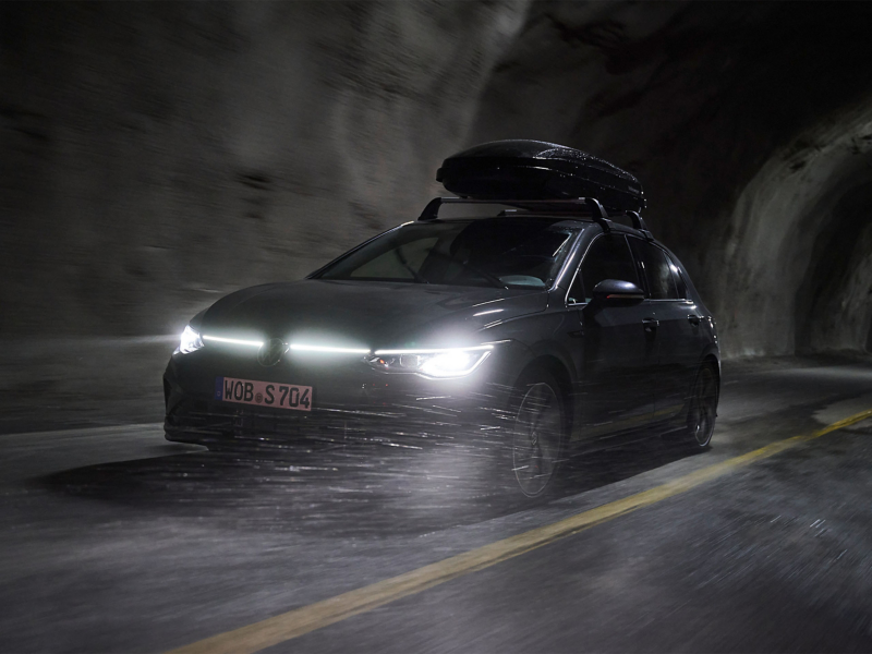 VW car driving through mist with hard shell car accessories  