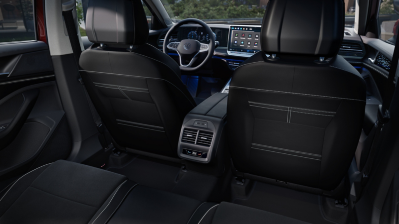 From the right rear seat, we look at the backs of the front seats with the climate control for the second-row passengers and into the Passat's cockpit.