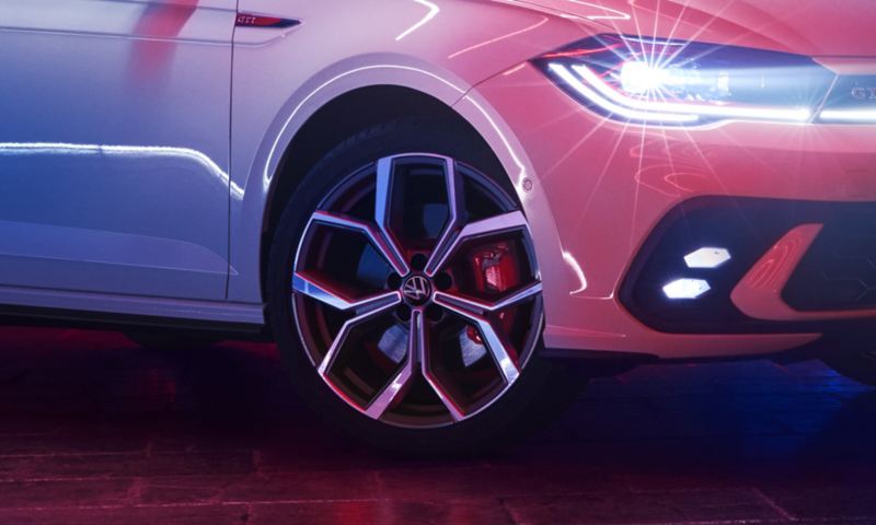 Close-up of a wheel rim on a white VW Polo GTI.