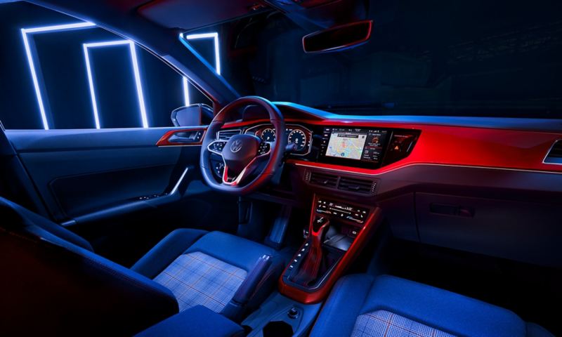 View from the rear bench seat to the cockpit of the VW Polo GTI with the multifunction sports steering wheel in leather, Digital Cockpit Pro and the optional Climatronic air conditioning system.