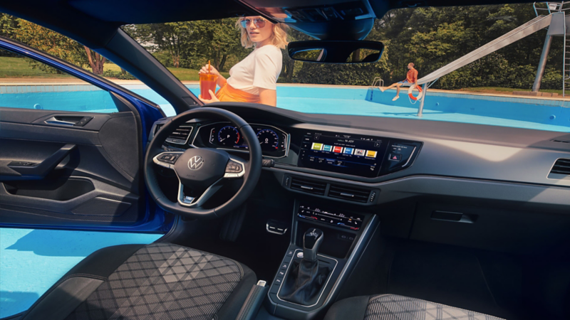 Interior of a Volkswagen Polo R line showing the steering wheel, digital cockpit, and central infotainment display