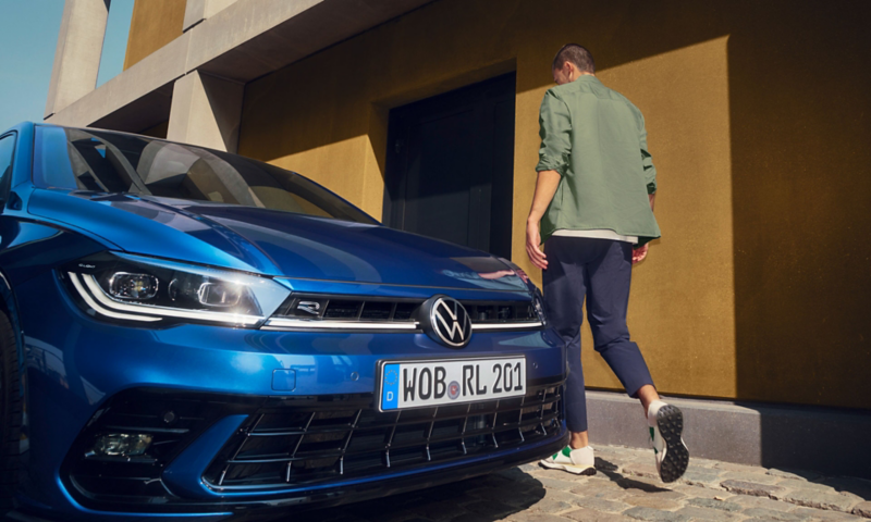 Front of a blue VW Polo with the IQ.LIGHT LED matrix headlights, the bonnet and bumper.