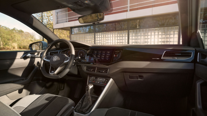 A view of the cockpit with steering wheel and infotainment system in the VW ID. Polo.
