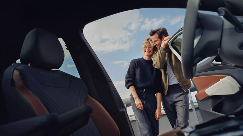 Couple opening a car door
