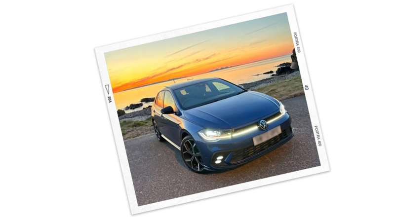 A photo of a Volkswagen Polo on a coastal road