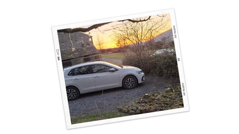 A white Polo parked in the street