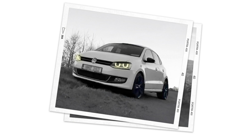 A photo of a white Volkswagen Polo 