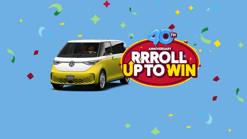 Promotional graphic with confetti on a blue background showing a yellow-and-white Volkswagen ID. Buzz van beside a red badge that reads “40th Anniversary RRROLL UP TO WIN”. 