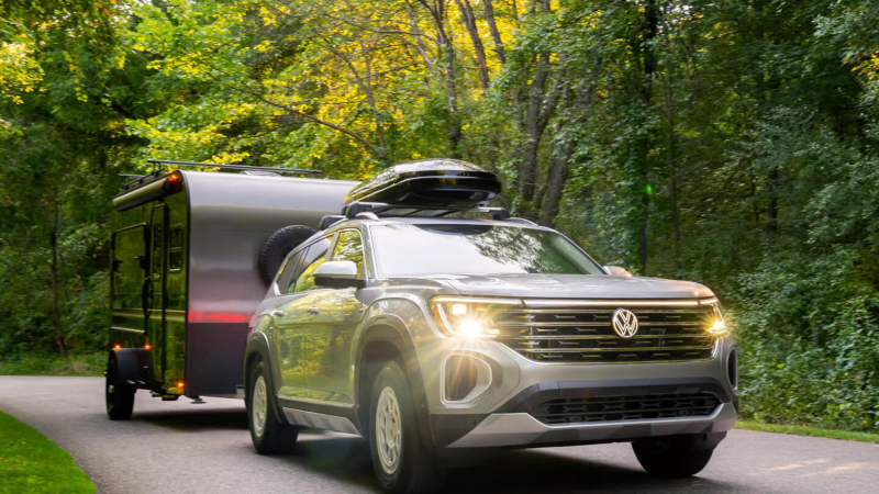 Volkswagen Atlas driving through greenery. 