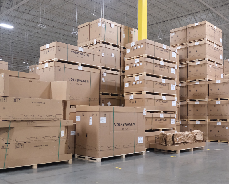 Volkswagen parts boxes stacked in Cranbury, NJ distribution center.