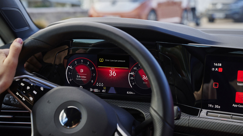 Close-up of VW cockpit with illuminated warning light