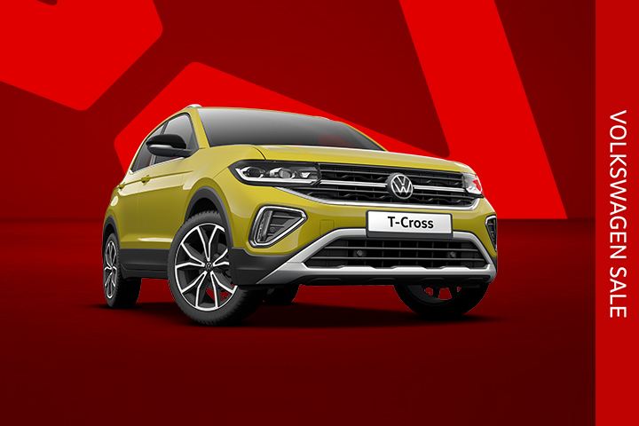 A yellow T-Cross front view from low angle on a red background