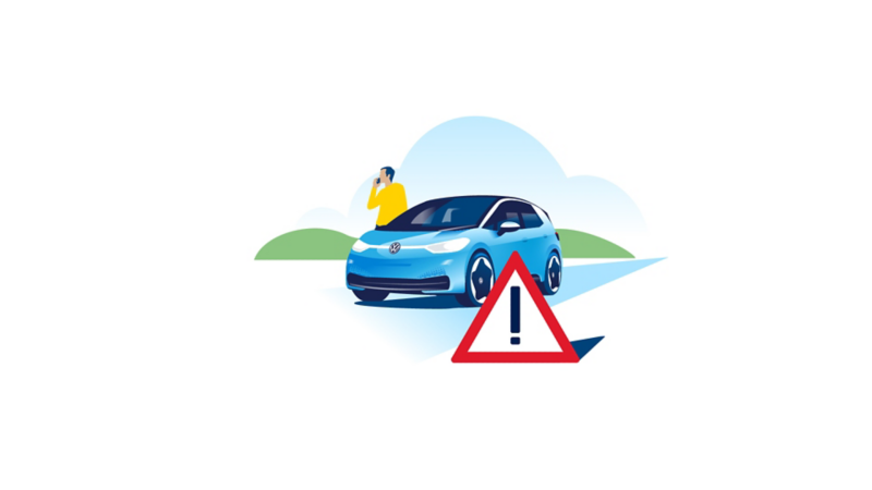 There is a warning triangle in front of a Volkswagen ID.3 with a man on the phone behind him.