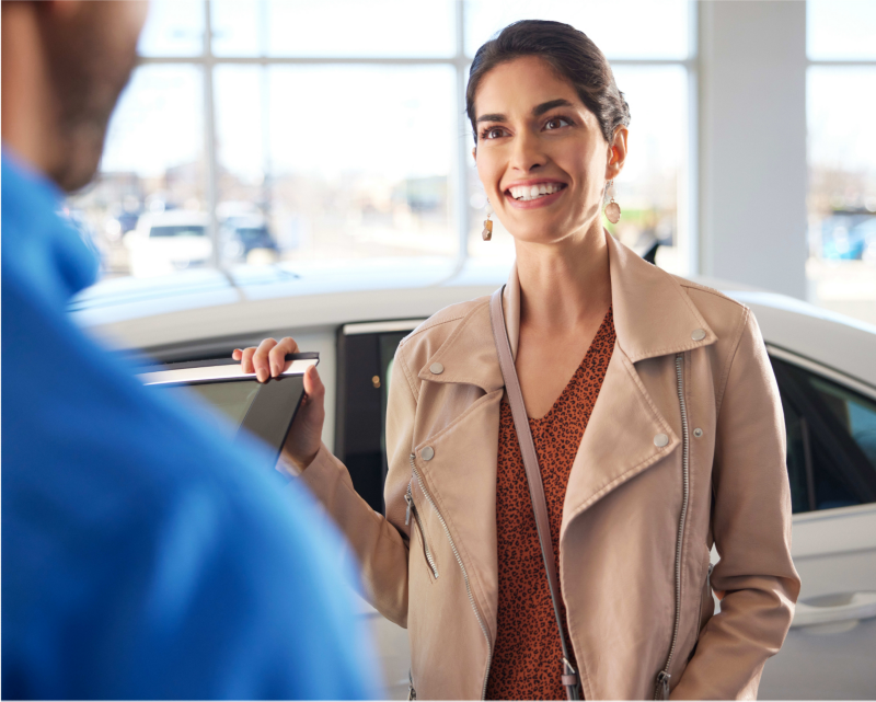 Woman in VW dealership.