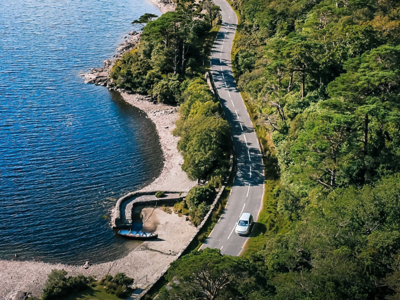 Volkswagen Golf Ariel Shot of Car Driving on Winding Road in Between Trees 