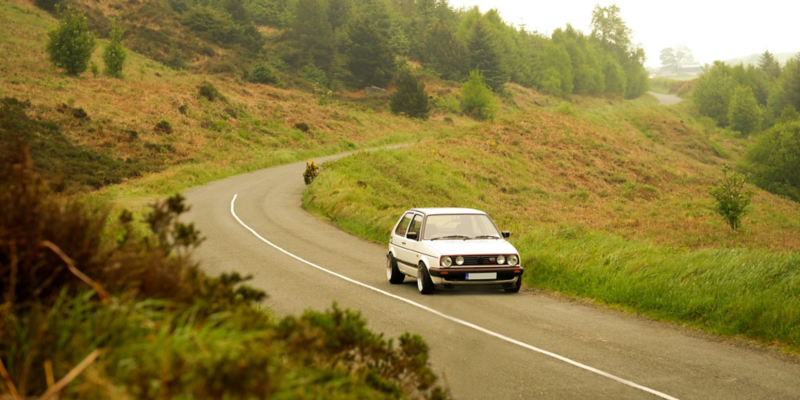 Golf on empty scenic road in Irish countryside