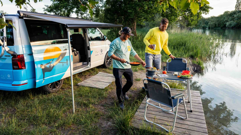 Preparing a meal by the lake.