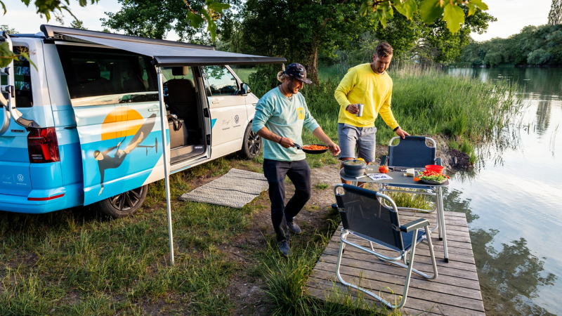 Preparing a meal by the lake.