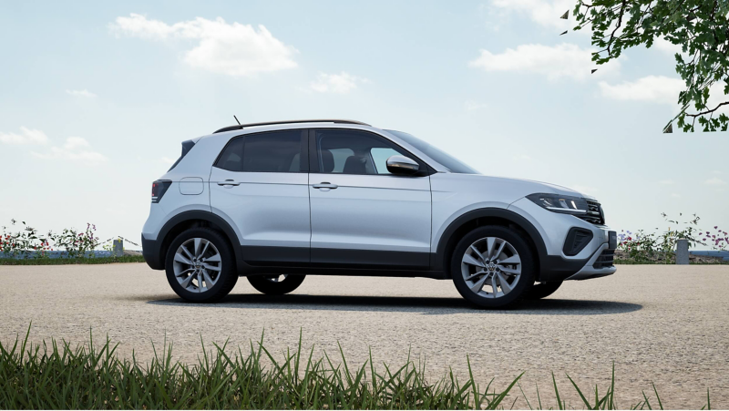 A white T-Cross Match parked near some bushes by the ocean