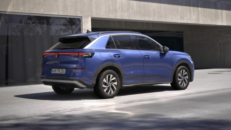 rear view of a blue T-Roc life parked outside a concrete carpark