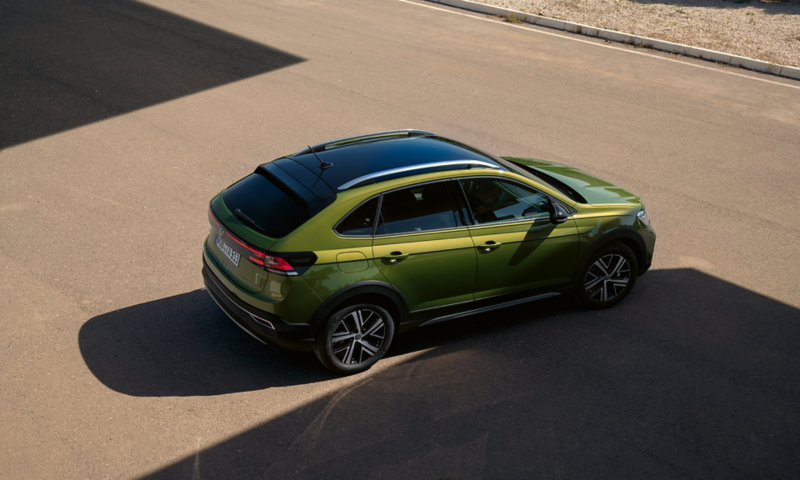 Green VW Taigo Style with optional roof pack, the side is visible from above