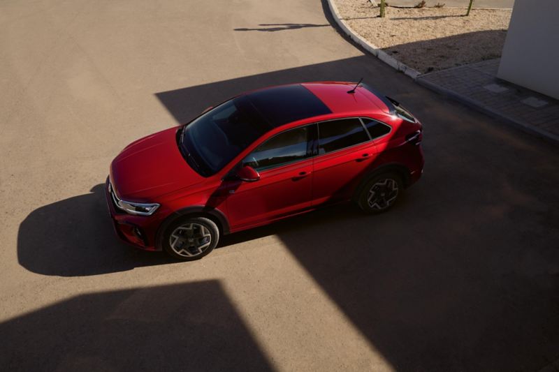 Red VW Taigo R-Line, the side is visible from above, view of the black roof railing