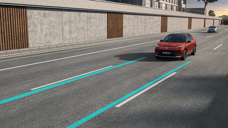 The illustration demonstrates how Lane Assist works using a VW T-Roc as an example.