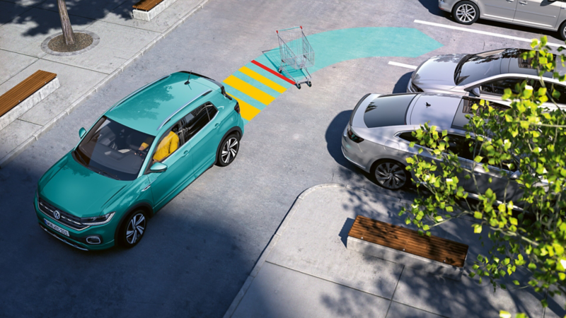 Volkswagen T-Cross parkuje używając czujników. Sensoryka przedstawiona przy użyciu strzałki.