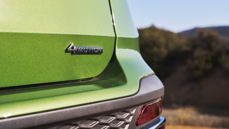Volkswagen 4MOTION All-Wheel Drive badge on green SUV rear showcasing advanced traction for Canadian roads.