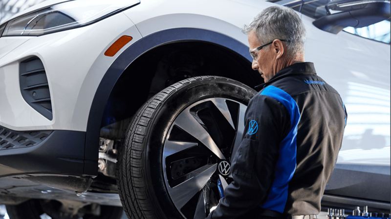 An ID.4 undergoing a wheel inspection