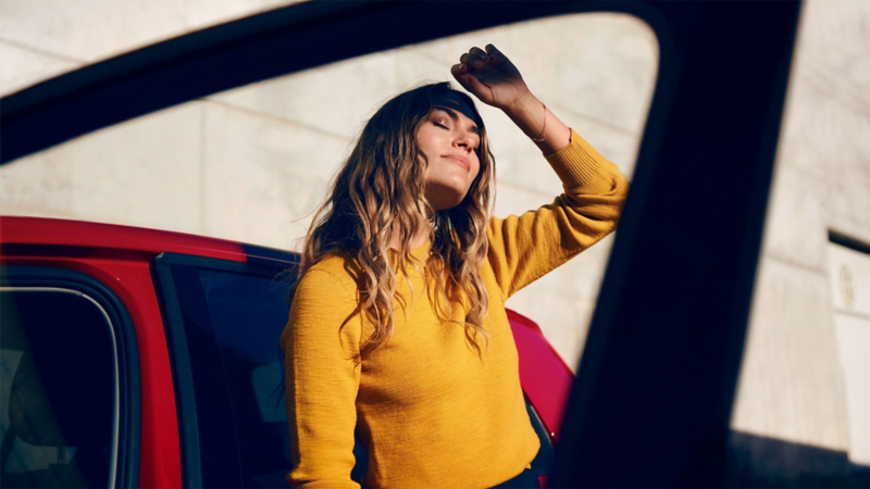 A woman gets out off a Volkswagen