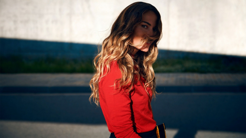 A woman in a red pullover
