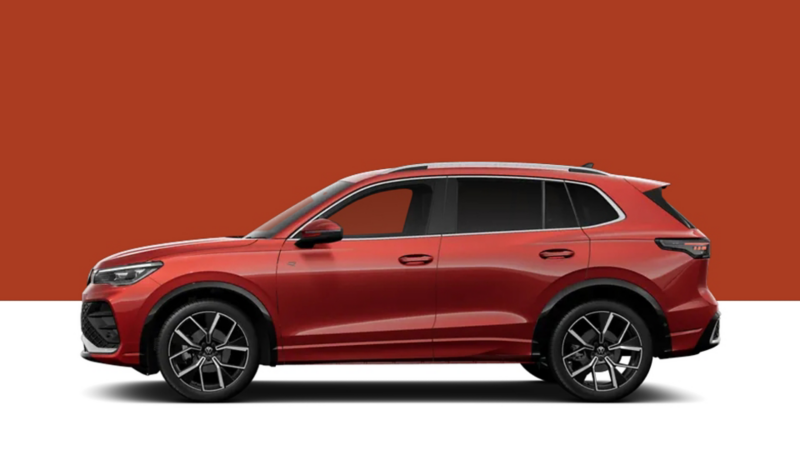Side view of a VW Tiguan on a red  background