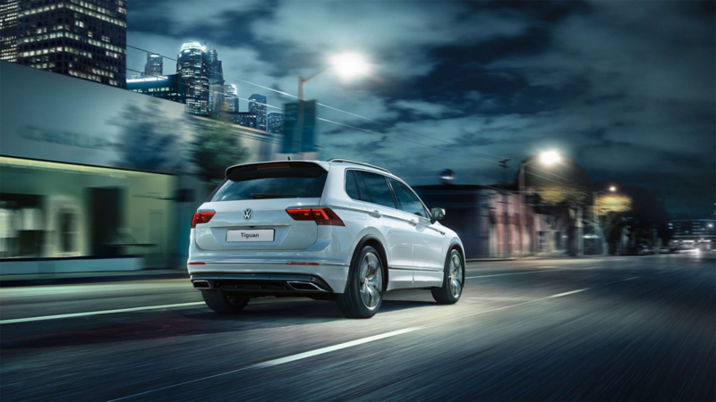 Rear-view of the Volkswagen Tiguan R-Line driving down a road