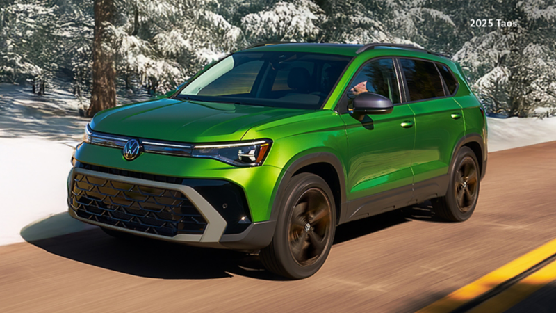 A Serrano Green Metallic VW Taos Comfortline Black Edition on a wintery road.