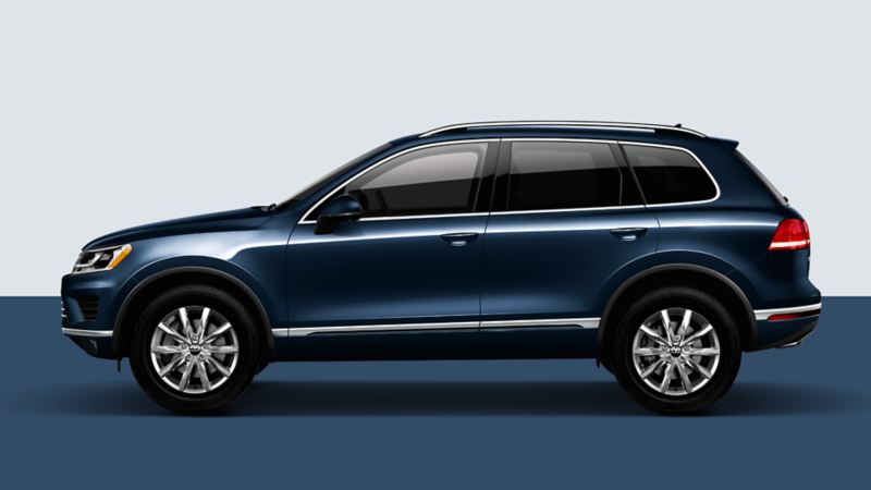 Side view of a volkswagen Touareg in a studio background