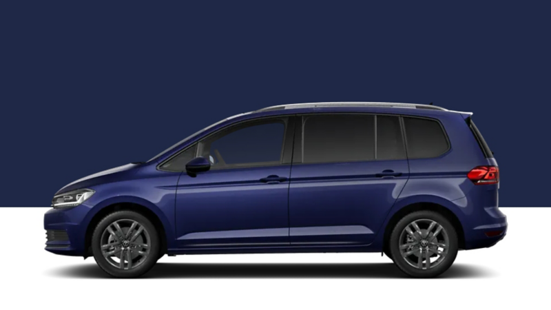 Side view of a VW Touran on a dark blue background