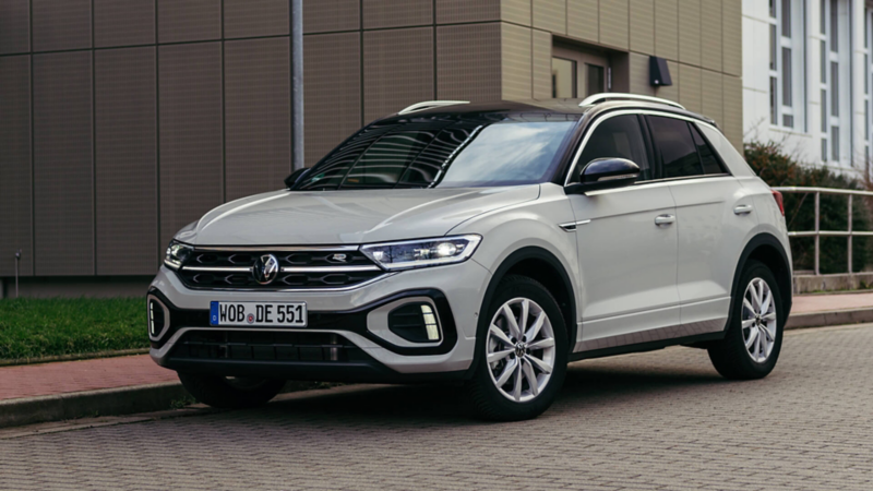 A white T-Roc 3/4 view parked on a concrete road