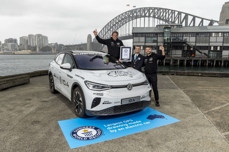 ID.4 by Sydney harbour bridge with two drivers
