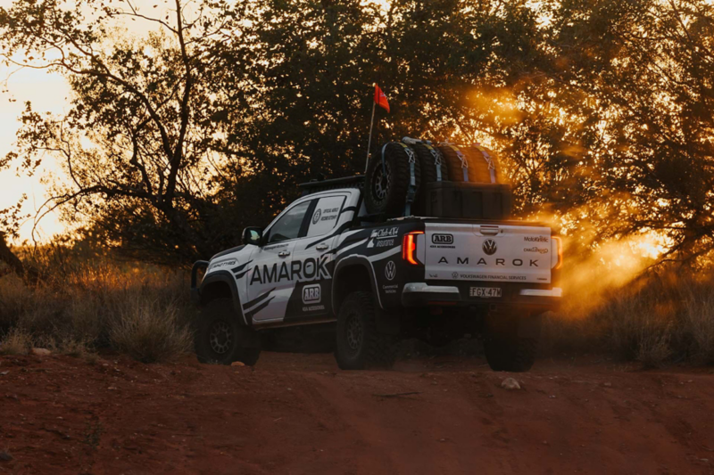 VW Amarok driving in the desert at sunset
