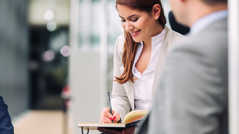 Female young VW professional making notes 