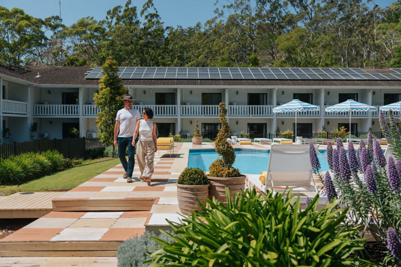 Couple walking by hotel pool