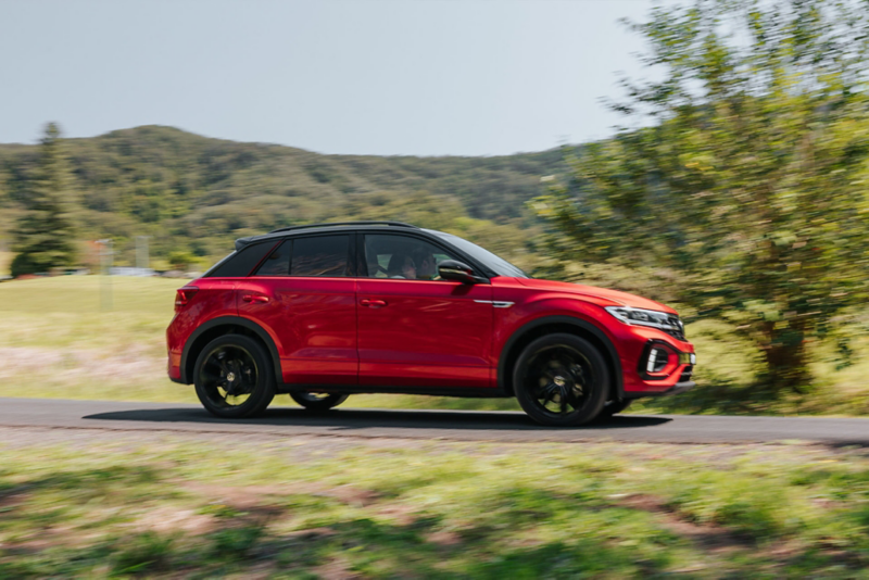 VW Red T-Roc driving in country side 