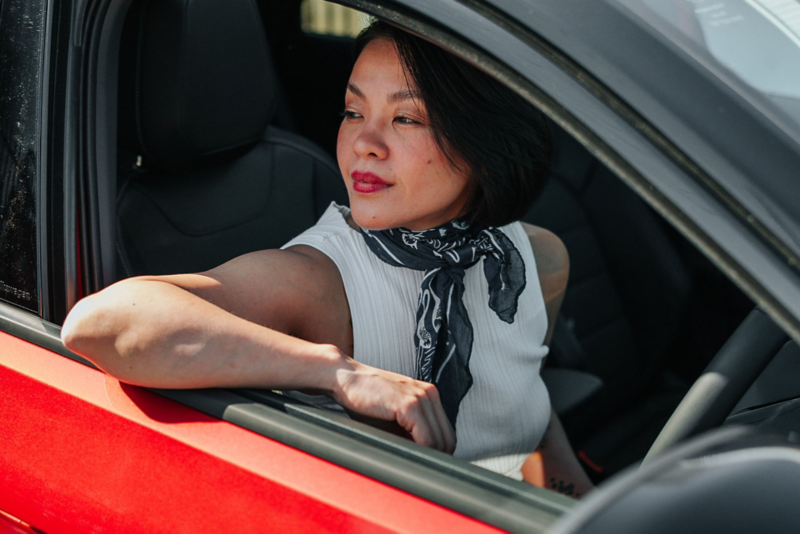 Woman looking out car window
