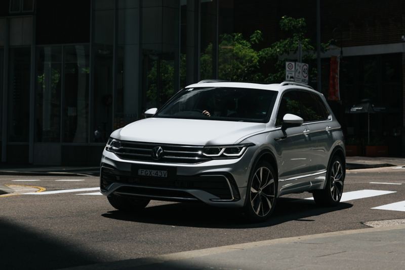 Man walking towards Volkswagen Tiguan.