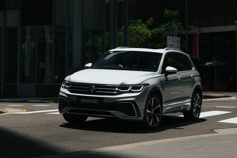 Man walking towards Volkswagen Tiguan.