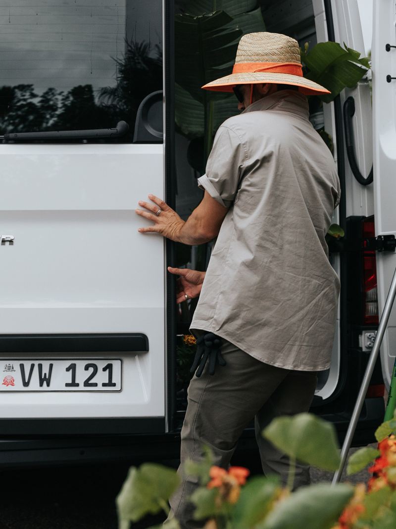 Man opening the back door of the Volkswagen Crafter van.