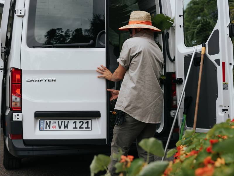 Man opening the back door of the Volkswagen Crafter van.